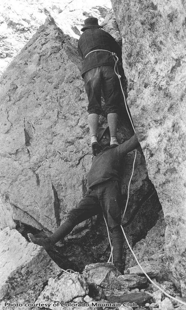 Albert Ellingwood doing a “Courte-echelle” with Carl Blaurock, circa 1920. Photo courtesy of the Colorado Mountain Club.