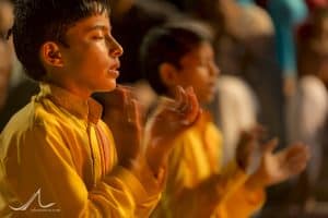 The faithful perform Ganga Aarti, a puja to the Ganges, at the Parmarth Niketan Ashram in Rishikesh, Uttarakhand, India.