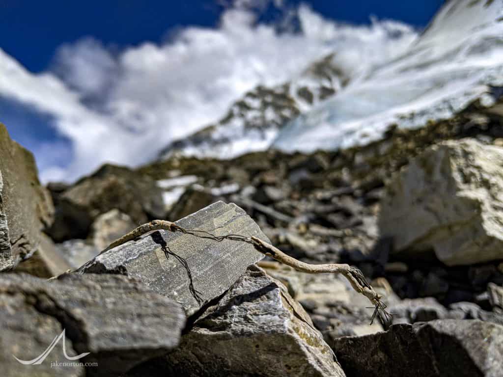 A small piece oif telephone wire from the 1933 British Everest Expedition lies on the trail en route to Advanced Basecamp, Tibet.