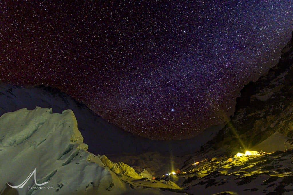 Stars and a bit of the Milky Way rise above Advanced Basecamp and the North Ridge of Mount Everest, Tibet.